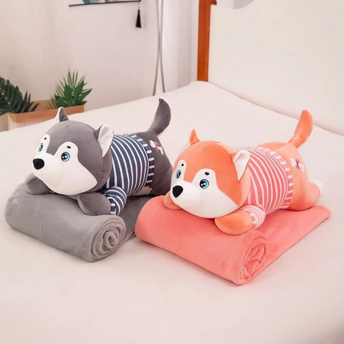 Perro de peluche con manta