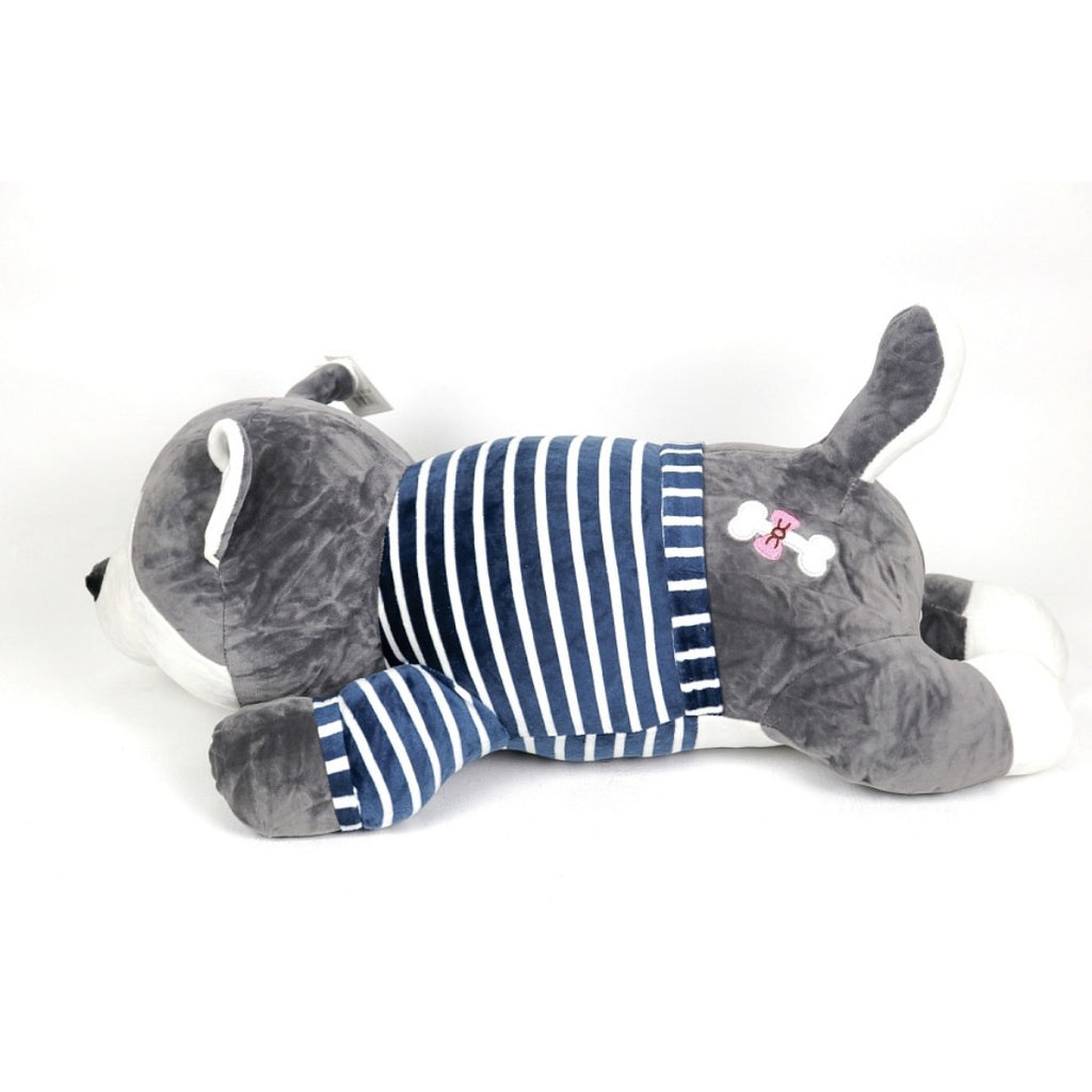 Perro de peluche con manta