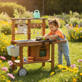 Cocina exterior con jardinera con rueditas
