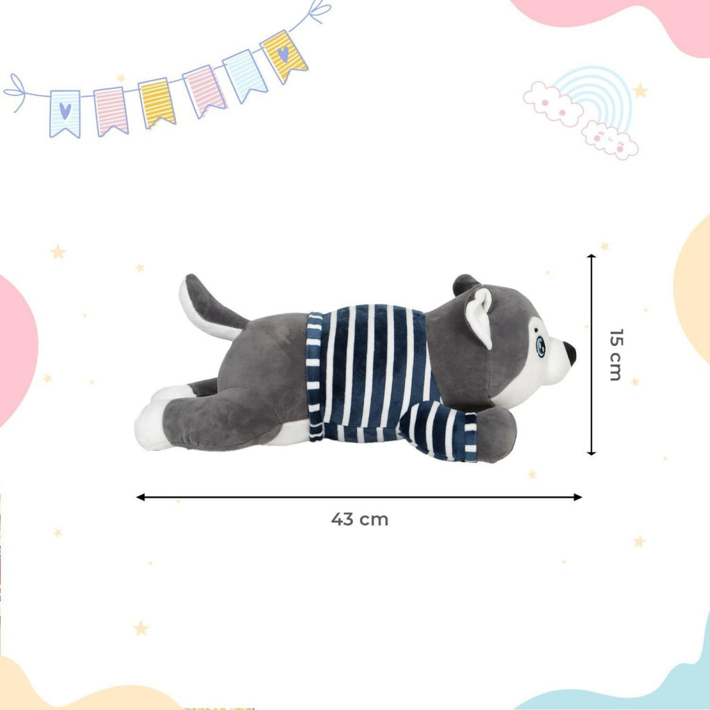 Perro de peluche con manta